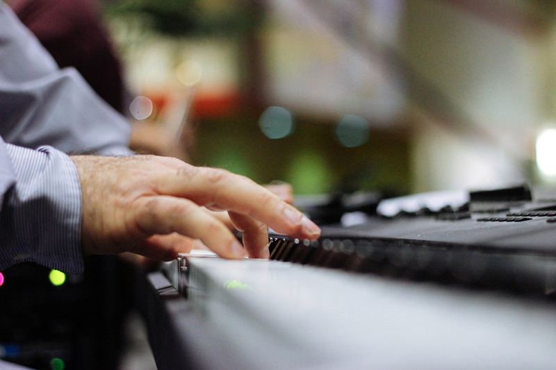 Fingers on piano keys
